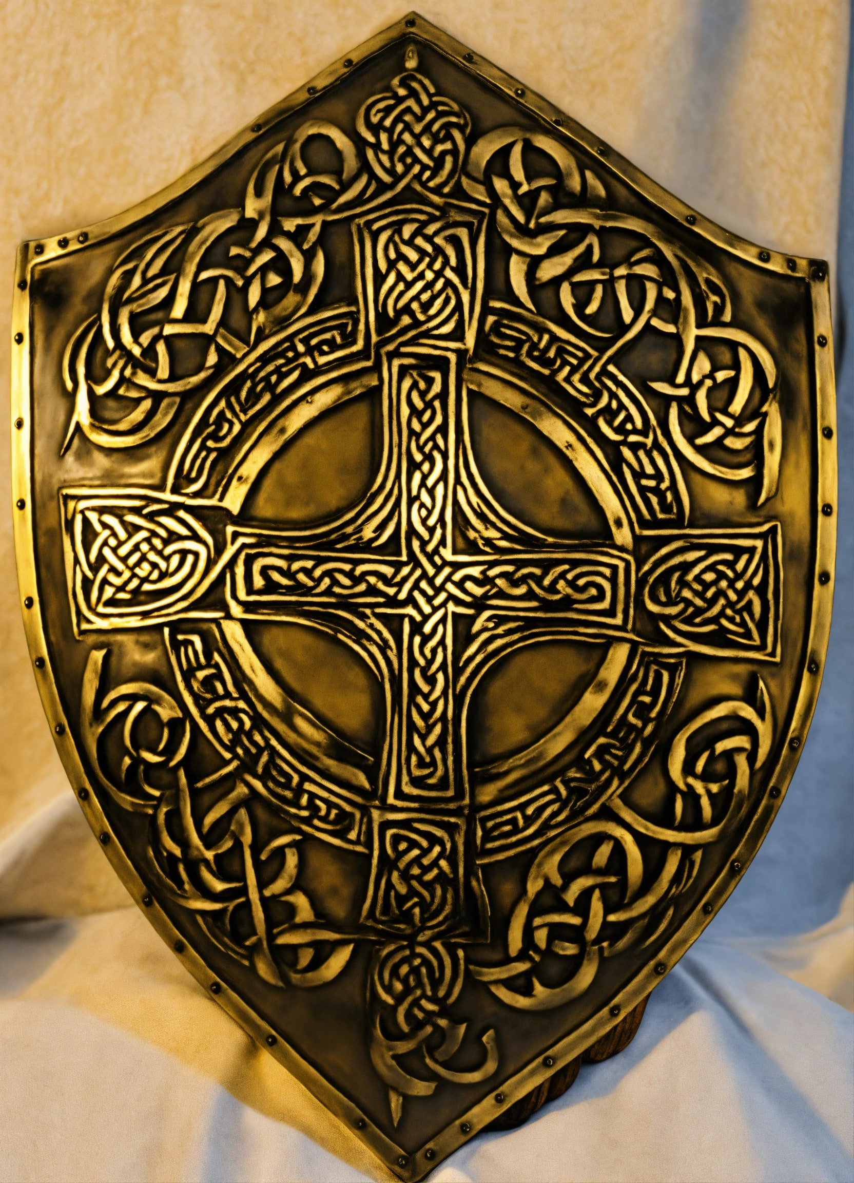 Bronze shield with Celtic cross design